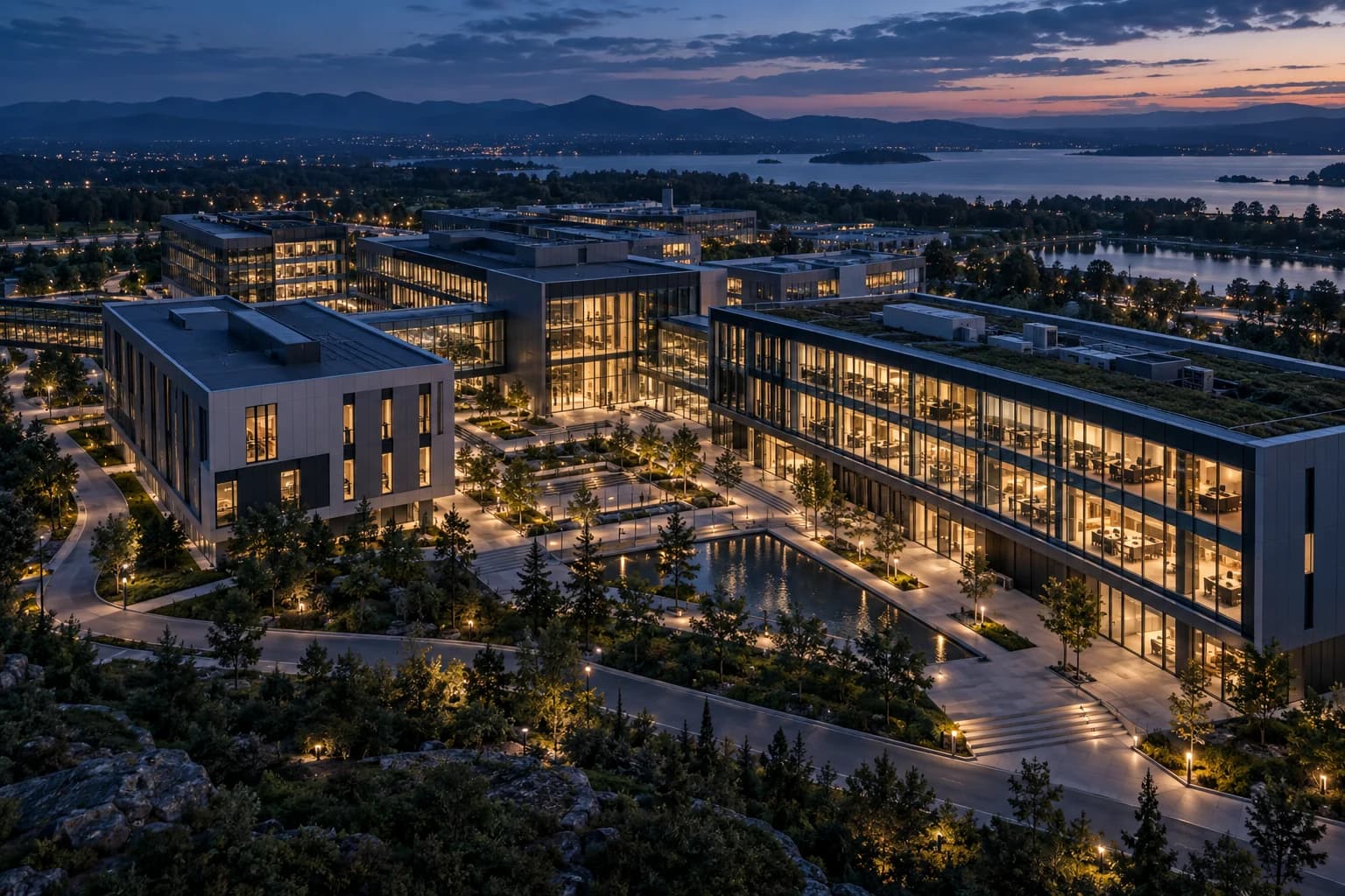 Illustrative connected commercial campus with several modern buildings at twilight